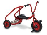 the tricycle is red with black wheels and a black seat