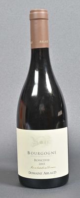 a bottle of wine that is sitting on a table