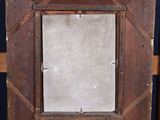 a picture of a picture frame on a wooden easel