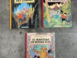 three children ' s books sitting on the floor next to each other