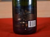 a bottle of wine that is sitting on a table