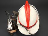 a white helmet with a red nose on a black background