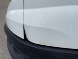 a close up of the front of a white van