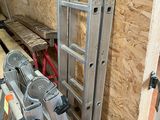 a ladder leaning against a wall in a room