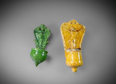 pair of yellow and green vases on a gray background
