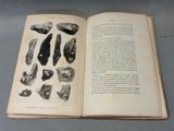 an open book with a bunch of rocks on it