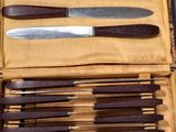 a box with a set of knives and knives in it