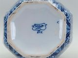 a blue and white vase with a blue and white design on it