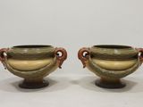 pair of green and brown vases with handles and handles