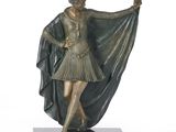 bronze statue of a woman in a dress holding a shawl