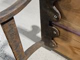 a wooden bench that is sitting in the middle of a room