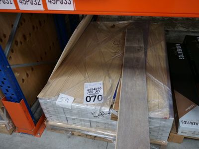 boxes of wood are stacked on a shelf in a store
