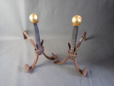 pair of antique iron candlesticks with brass balls on them