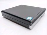 a close up of a black computer on a white surface