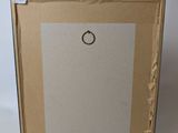 an empty picture frame sitting on top of a cardboard box