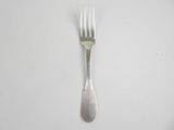 a fork and a spoon on a white table