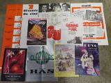 various movie posters are displayed on a table in a room