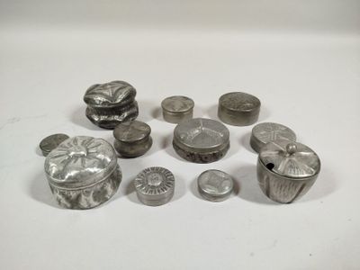 a lot of silver objects on a white surface
