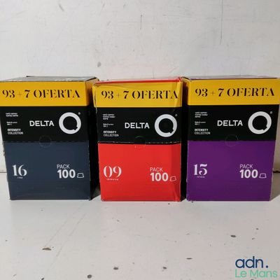 three boxes of delta film sitting next to each other on a table