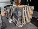 many stacks of wooden pallets stacked on top of each other
