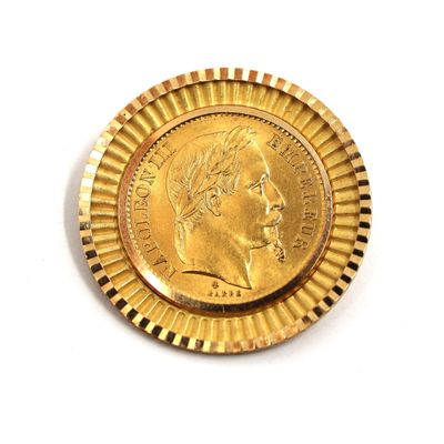 a close up of a gold coin on a white surface