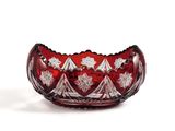 an image of a red glass bowl sitting on top of a white surface