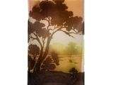 a glass vase with a picture of a tree on it