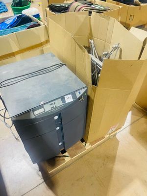 many boxes of computer equipment in a room