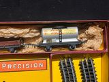 a box with a train set in it on a table