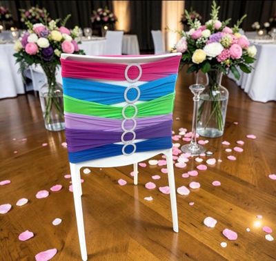 a chair that has been decorated with ribbons and flowers