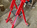 an image of a red work stand in a workshop