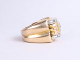 an image of a gold and diamond ring on a white background