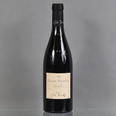 a bottle of wine that is sitting on a table