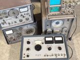 several electronic equipment sitting on top of each other in a room