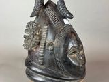 an image of a metal head with a bird on top of it