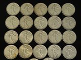 a lot of coins that are sitting on a table
