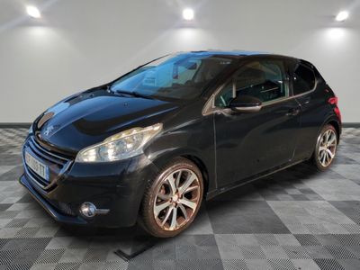 a black car is parked in a room with a checkered floor