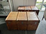 three trunks sitting on the floor next to each other