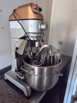 a mixer that is sitting on a counter in a kitchen