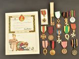 several medals and a certificate are on display on a table