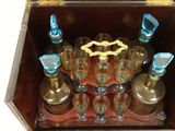 a wooden box that has a bunch of bottles inside of it