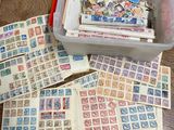 many different stamps in a container on the table