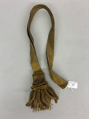 an image of a long brown ribbon with a tassel on it