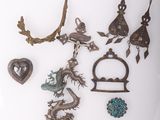 several pieces of jewelry are displayed on a white surface