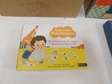 a box with a picture of a child playing with cards