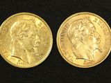 two gold sovereigns, one with the head of a woman and one with a crown