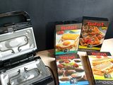several boxes of food sitting on top of a table next to a toaster