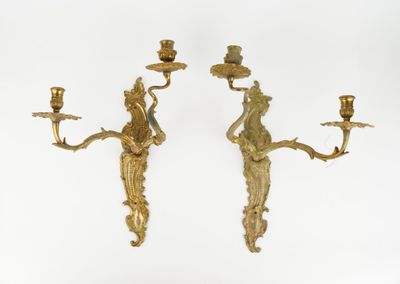 pair of antique brass wall sconces with figures on them