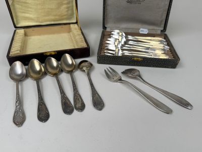 a lot of spoons and forks in a case