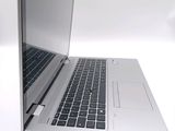 a close up of a laptop computer on a white surface